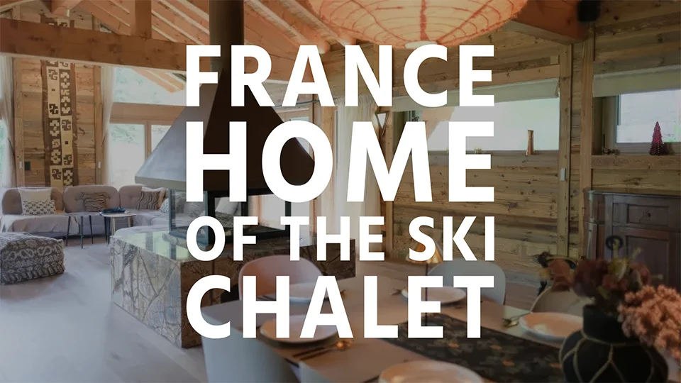 The interior of a stylish ski chalet in France with text overlay 'France - Home of the Ski Chalet'