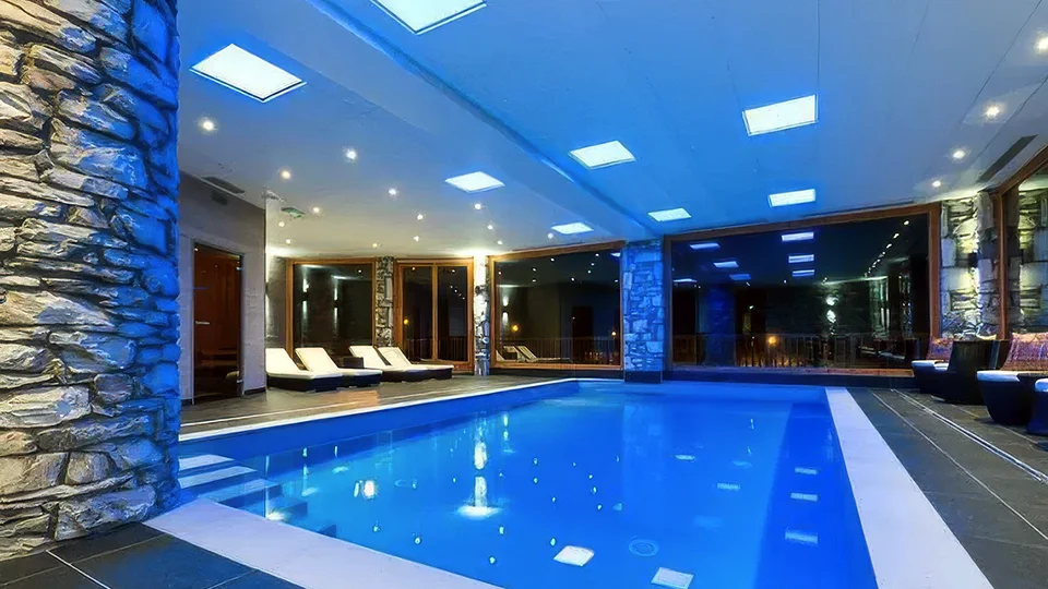 A ski chalet with a swimming pool
