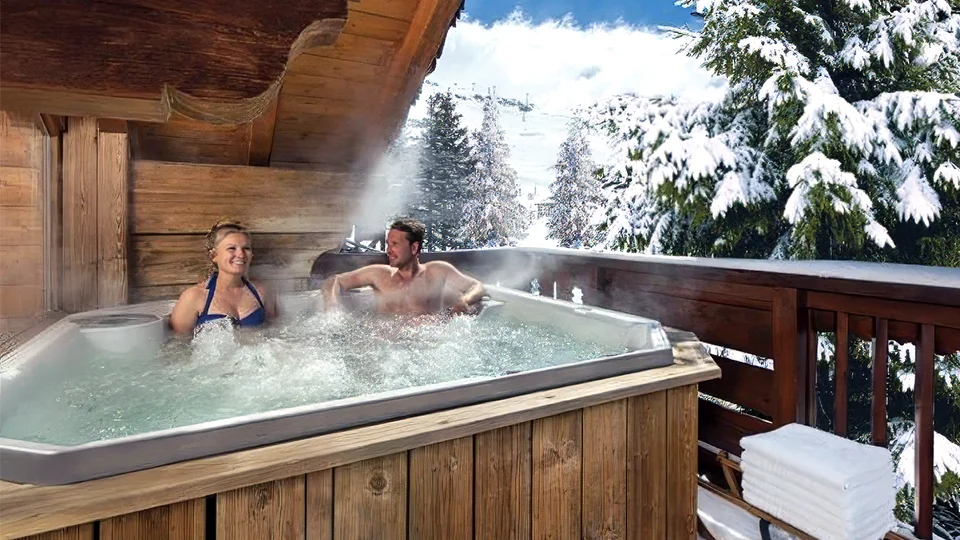 A couple enjoying a hot tub in a Ski Chalet in March