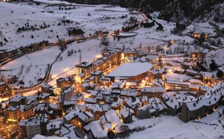 Ski holidays in Canillo. A photo of the ski resort of Canillo in Andorra, taken from high in the mountains looking down at twilight.