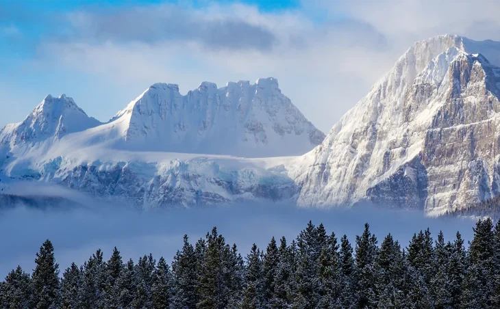 An epic mountain and forested landscape of Canada's Banff National Park. Banff is an outstanding location for ski holidays in Canada.
