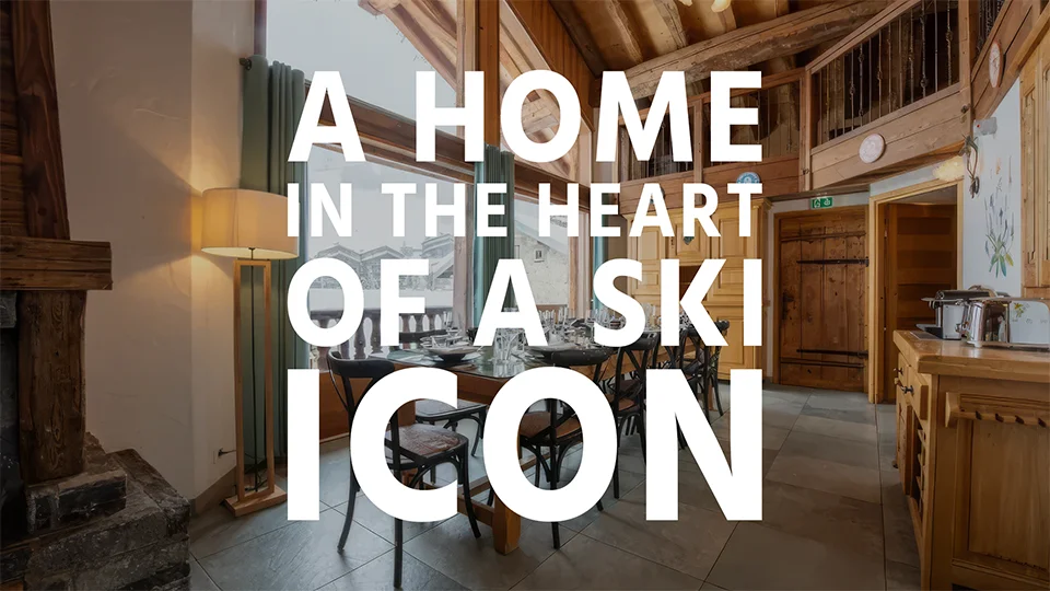 A ski chalet dining room in Val d'Isere, with overlay text "A home in the heart of a ski icon"